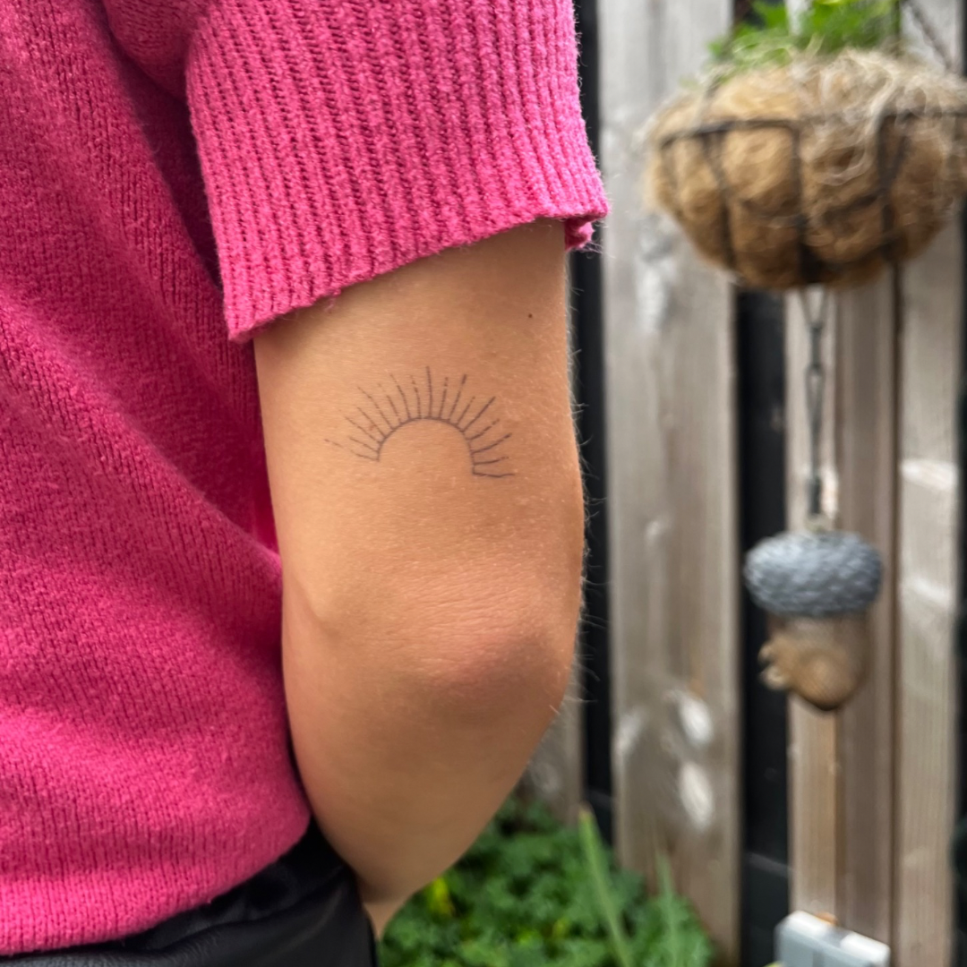 Temporary tattoo sun